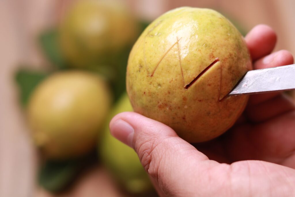 A Creative Carving on the Ripe Pink Guava