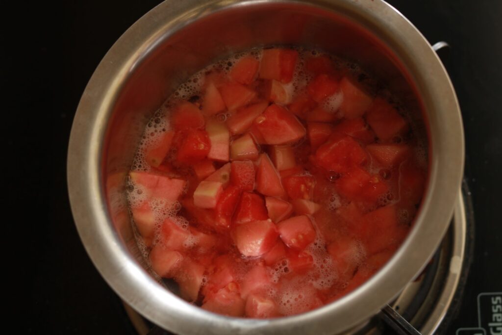 A pot of guava slices simmering on the stove, filling the kitchen with a delightful aroma