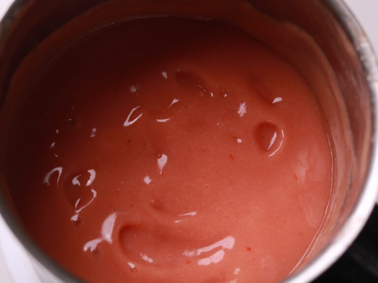 Blending the guava and chili puree for a silky-smooth mixture