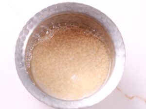 A bowl of soaked Urad Dal, a staple ingredient in Indian cuisine