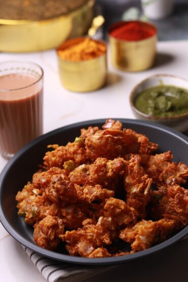 Golden crispy cabbage pakoras on a plate, ready to be enjoyed