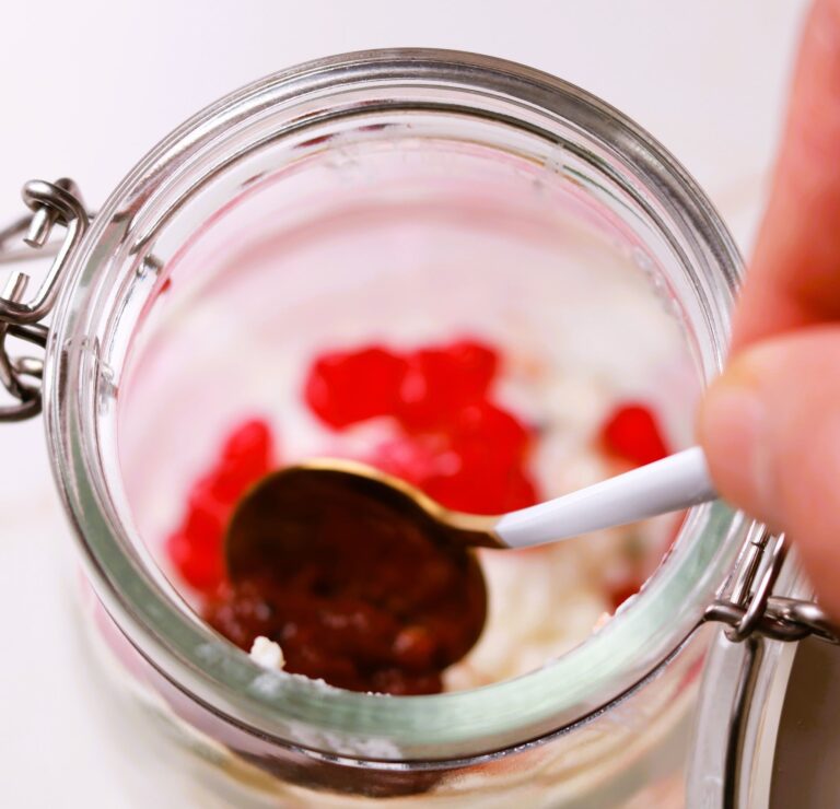 Layered Millet Curd Rice in a Glass Jar.