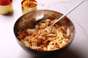 A bowl of pakora mix ingredients
