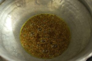 Pouring vegetable oil in sizzling pan.