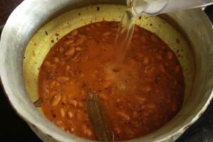Rajma masala preparation with pouring water