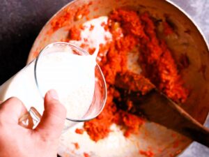 Halwa prep: Pouring fresh milk