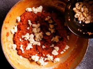 Gajar ka halwa- Enhancing flavors with mawa and cashew.