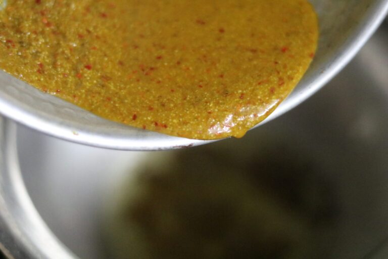 Wet masala paste being added