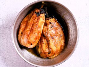 Peeling brinjal for rustic aroma.