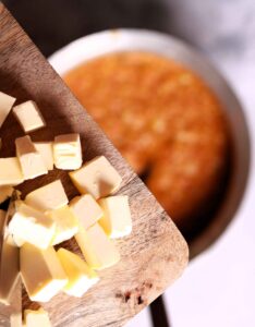 Melted butter mixing with Pav Bhaji