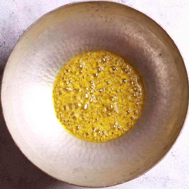 Crackling cumin seeds in pan