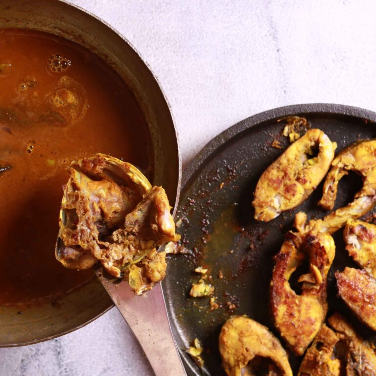 Fried fish simmering in curry