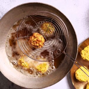 Frying golden brown koftas