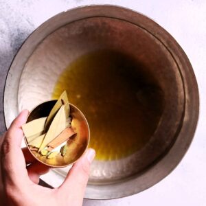 Heating mustard oil in wok
