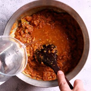 Pouring water into gravy