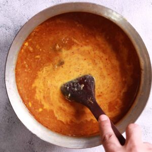 Stirring milk into gravy