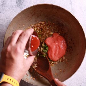 Tomato puree added in the chingri macher malai curry recipe
