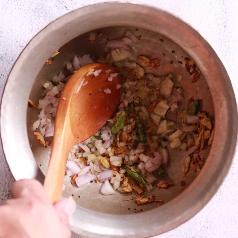 Onions sautéing golden brown for bhatt ki churkani