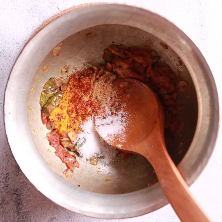 Spices mixing in pan for bhatt ki churkani recipe