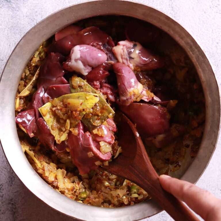 Adding chicken liver to the pan