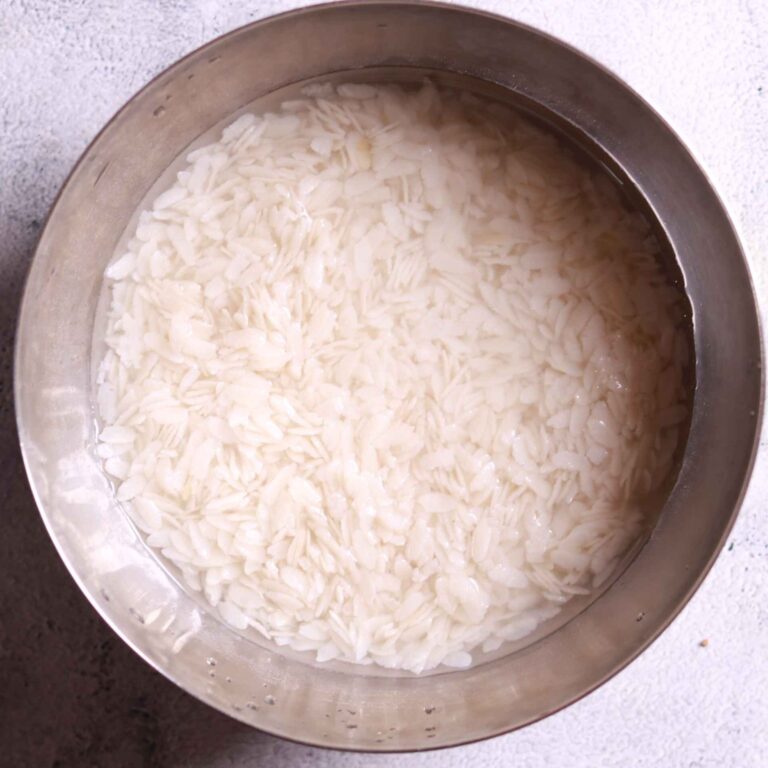 Rinsing poha in colander