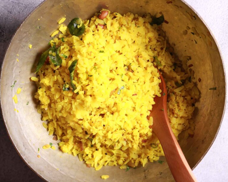 Adding peanuts coriander poha