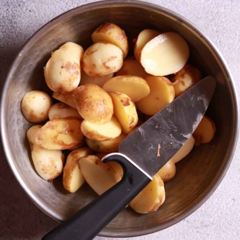 Baby potatoes being peeled