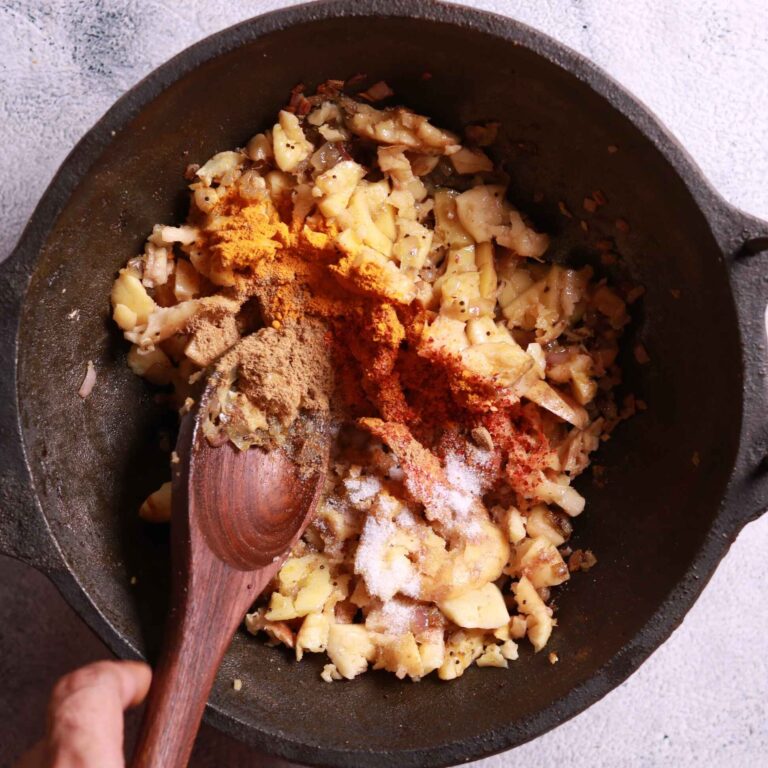 Crushed potatoes added to pan