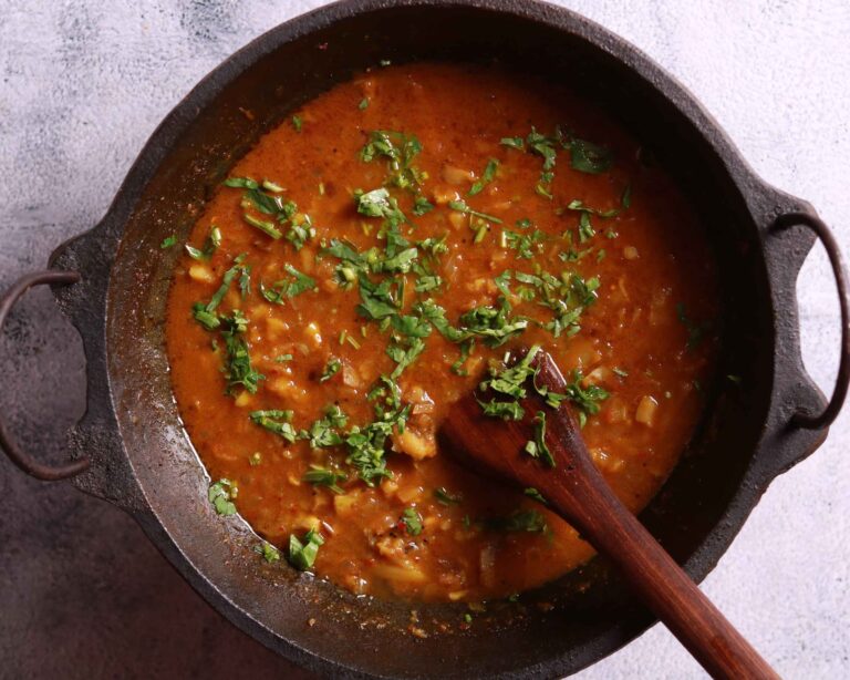 Garnishing potato curry coriander