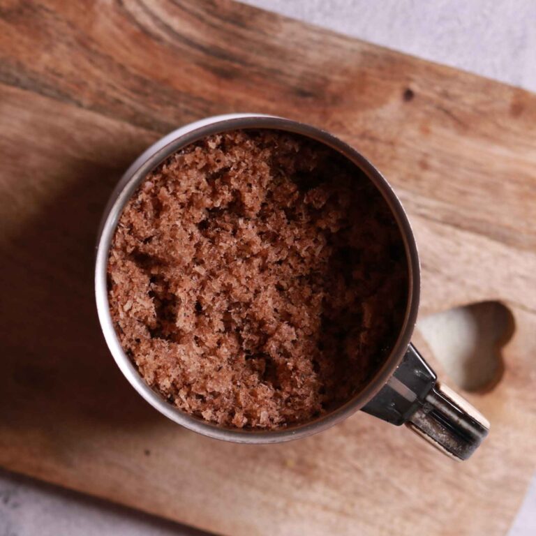 Grinding roasted coconut