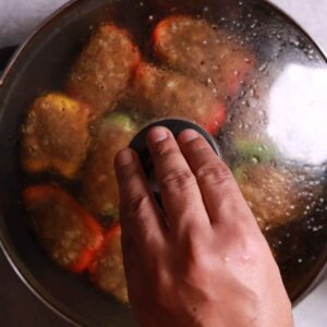 Steaming covered stuffed capsicums