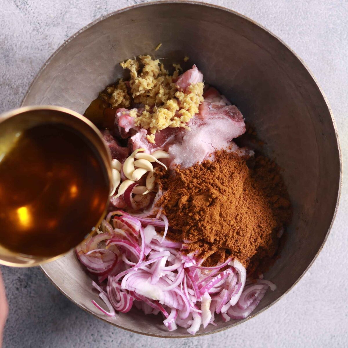 Adding ingredients to mutton