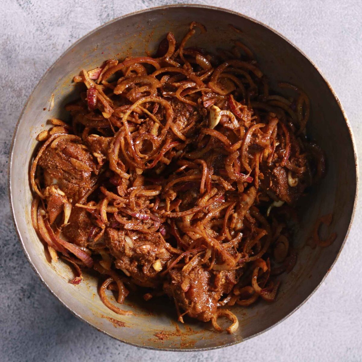 Mixing mutton with spices