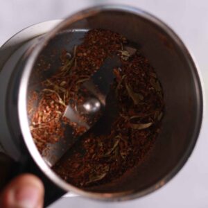 Grinding roasted spices into powder