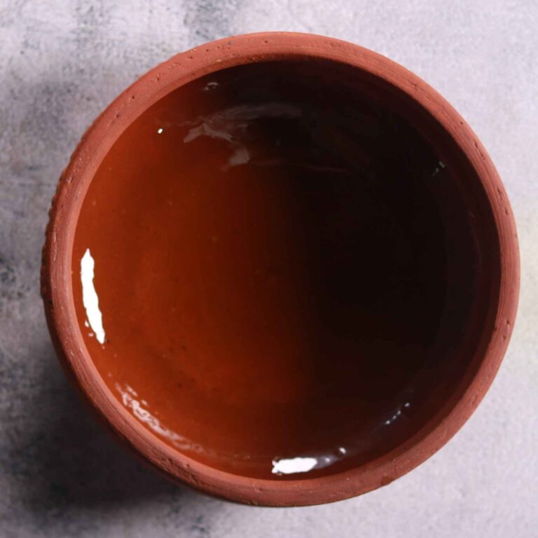 Heating mustard oil in clay pot