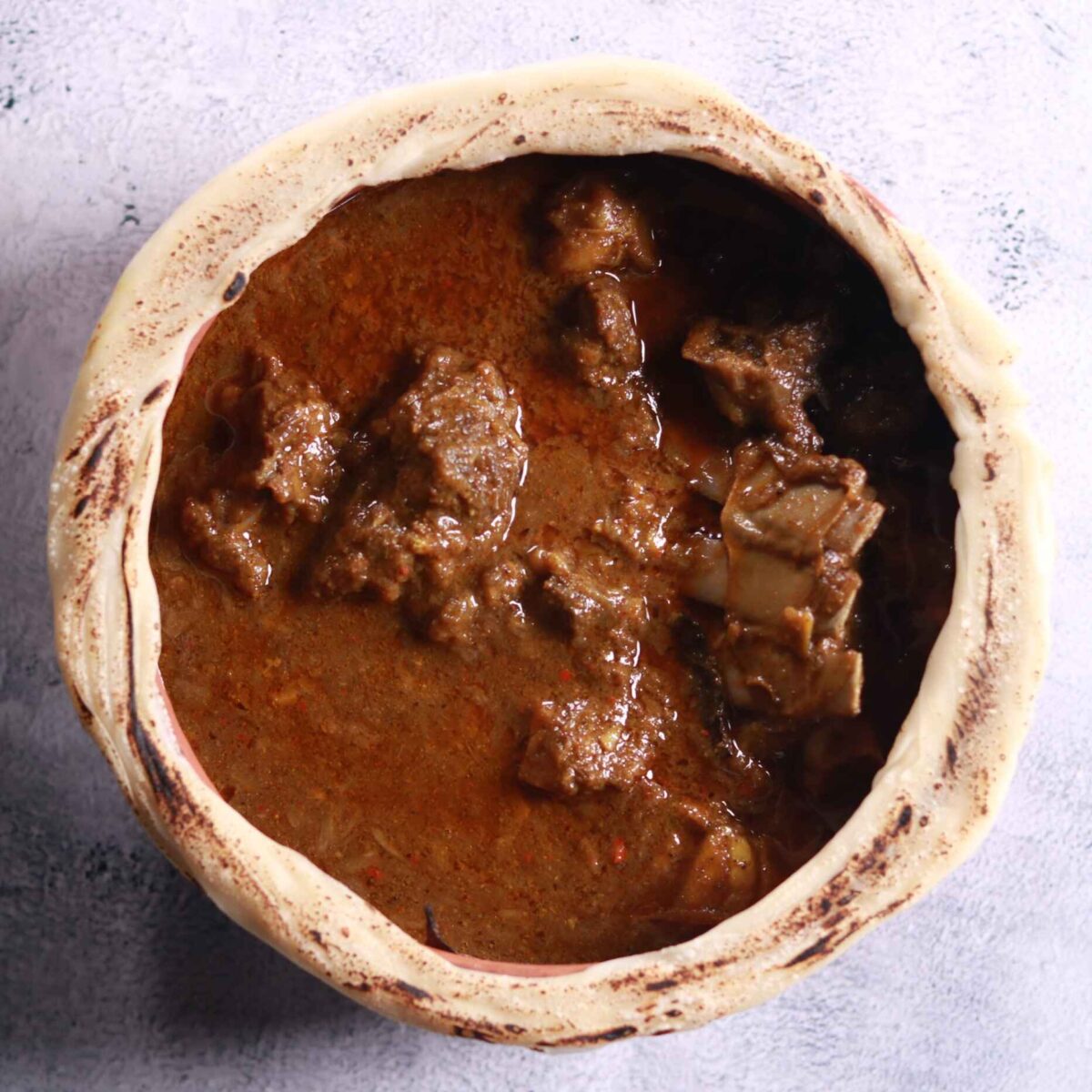 Removing seal from cooking pot