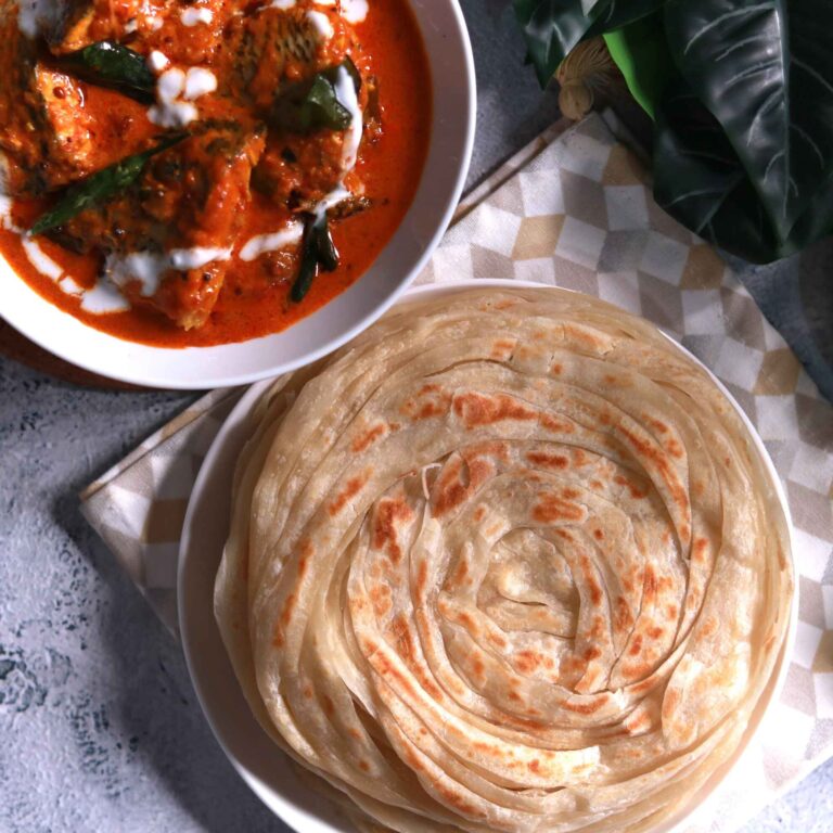 Serving parotha with curry