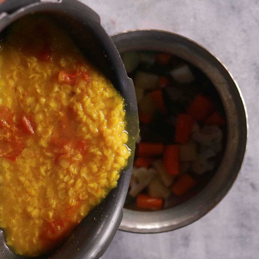 Mixing dal with vegetables