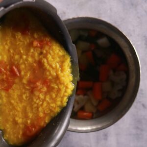 Mixing dal with vegetables