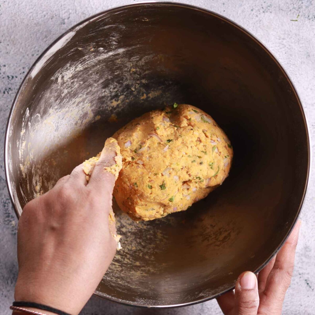 Rubbing ghee into mixture
