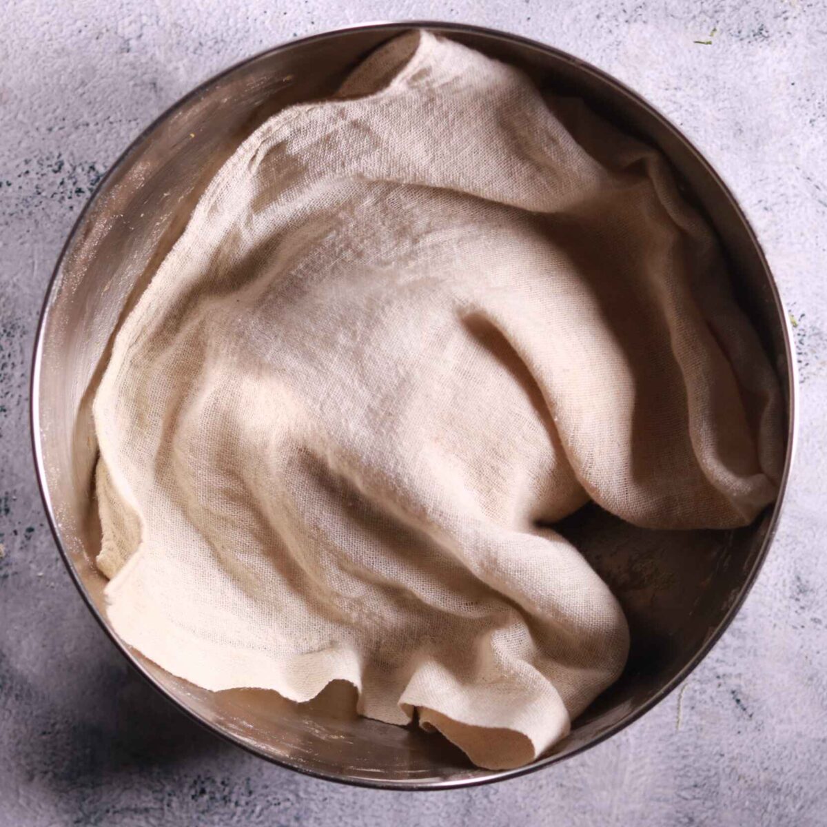 Dough resting under cloth