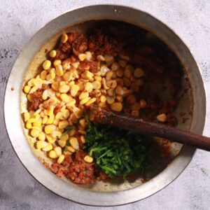 Adding corn and spinach