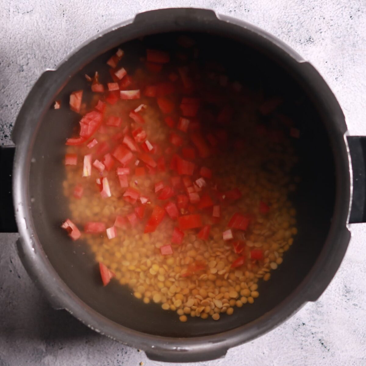 Adding toor dal to cooker