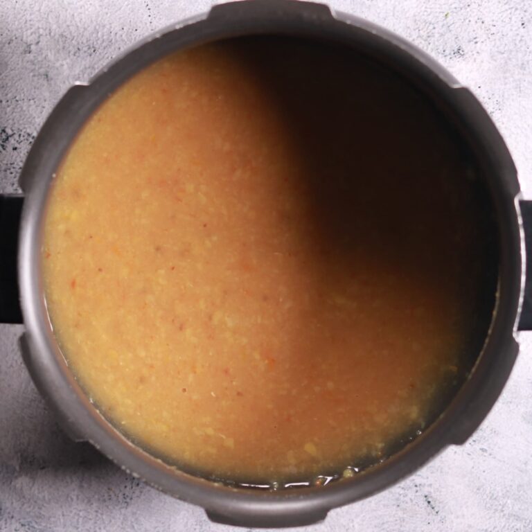 Mashing cooked dal mixture