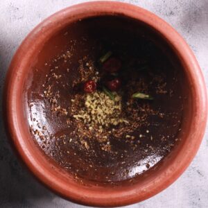 Adding crushed spice mix