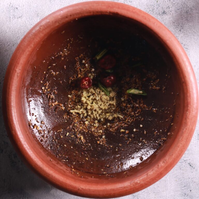 Adding crushed spice mix