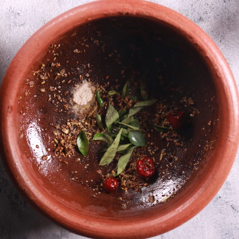 Sautéing ginger and curry leaves