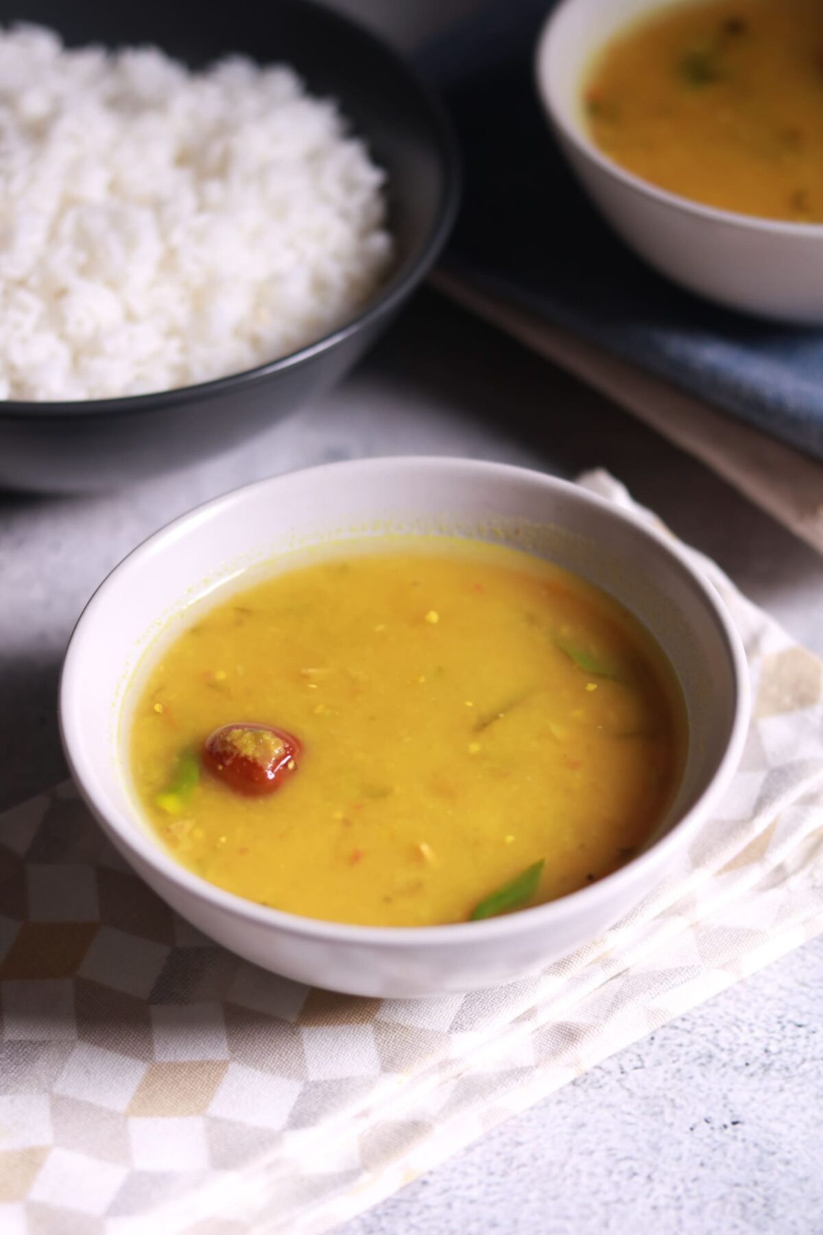 Serving lemon rasam