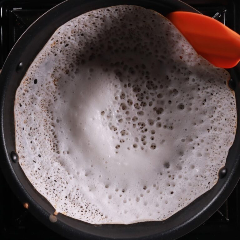 Removing cooked appam