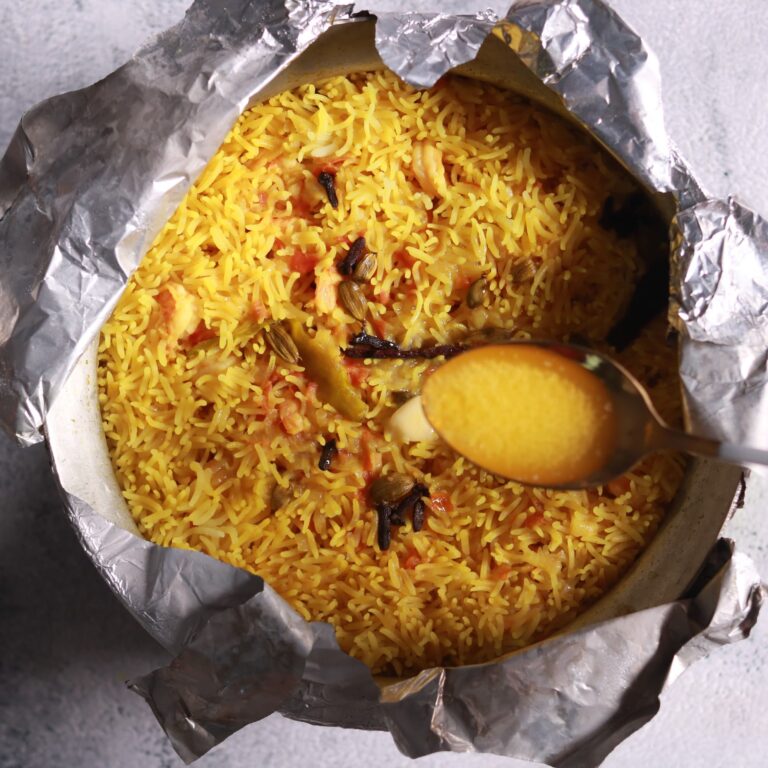 Drizzling ghee on pulao